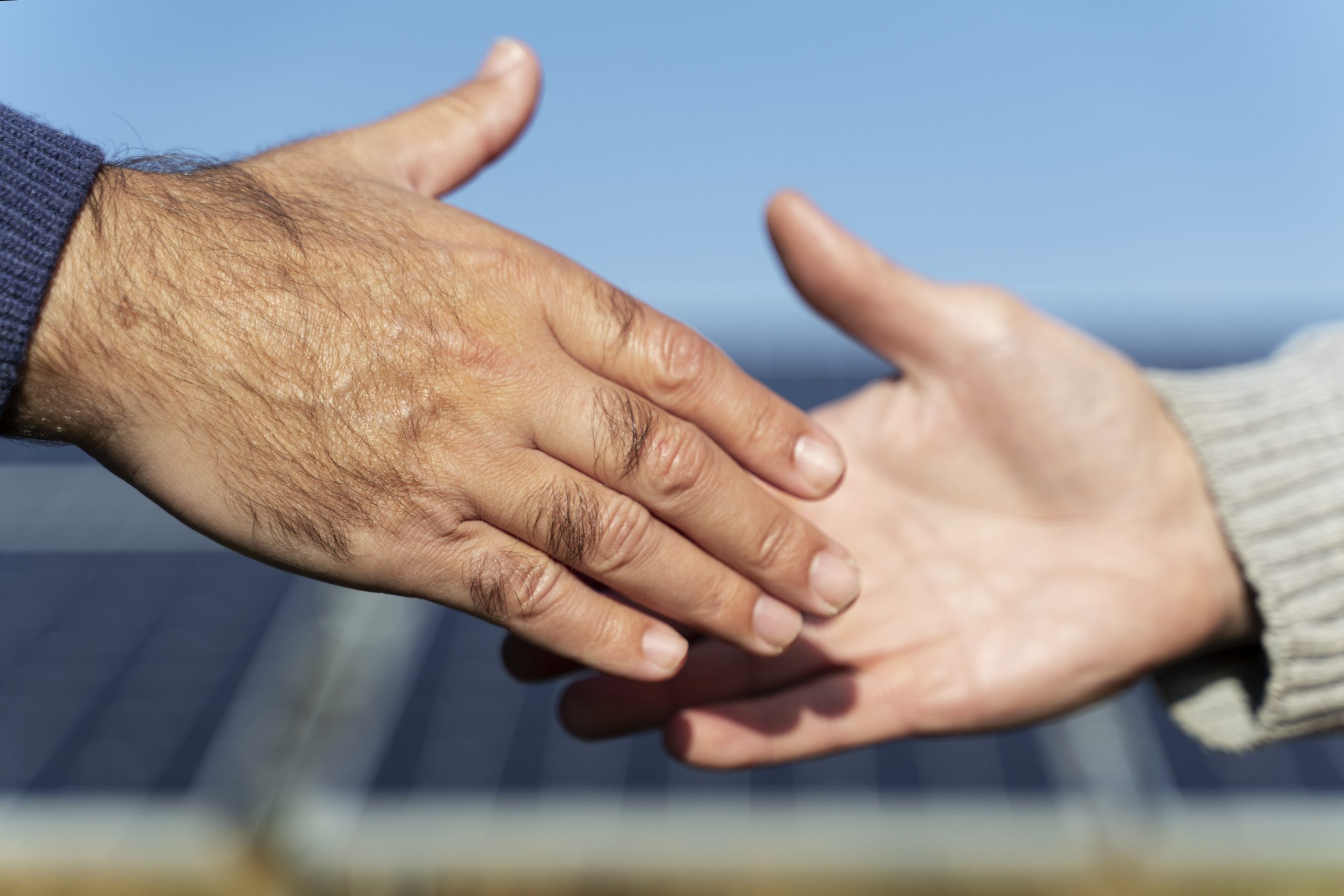 People Shaking Hands Near Alternative Energy Plant Scaled, Tiszta Energiák Kft.